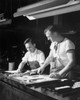 Two manual workers setting linotype in a newspaper composing room Poster Print - Item # VARSAL25539069
