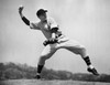 Baseball player pitching a ball Poster Print