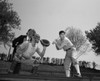 Three baseball players in back yard Poster Print