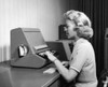 Woman using typewriter in office Poster Print - Item # VARSAL2551338