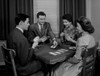 Two couples playing cards indoors Poster Print - Item # VARSAL255417072