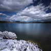 Tranquil lake and rocky shore against cloudy sky, Sardinia, Italy Poster Print - Item # VARPSTEVK200089S