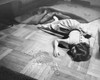 High angle view of a drunk young woman lying on the floor Poster Print - Item # VARSAL25541677