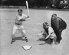 Baseball player swinging a baseball bat with a baseball catcher and a baseball umpire beside him Poster Print - Item # VARSAL25518197
