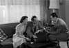 Couple talking with advisor in living room Poster Print - Item # VARSAL25527971
