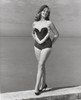 Young woman standing on a ledge Poster Print - Item # VARSAL25518816B