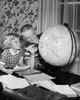 Boy and his sister looking at a globe Poster Print - Item # VARSAL25516386