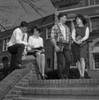 Two young couples on steps outside university Poster Print - Item # VARSAL255418382