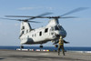 East China Sea, January 26, 2013 - An aviation boatswain's mate directs a CH-46E Sea Knight helicopter for take off from the amphibious assault ship USS Bonhomme Richard. Poster Print - Item # VARPSTSTK106748M
