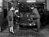 Salesman showing car to customers Poster Print - Item # VARSAL255418728