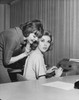 Side profile of a businesswoman whispering to another businesswoman in an office Poster Print - Item # VARSAL25528017