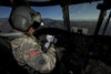 CH-47 Chinook pilot refers to his checklist while in flight to Playas Training Area, New Mexico, during exercise Angel Thunder 2013. Poster Print - Item # VARPSTTMO101126M
