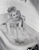 Young woman taking bath Poster Print - Item # VARSAL255418737