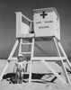 Boy standing near a lifeguard's chair Poster Print - Item # VARSAL25523980