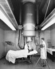 Two radiologists taking an x-ray of a patient Poster Print - Item # VARSAL25533911