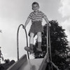 Boy on slide Poster Print - Item # VARSAL255420827