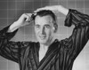 Mature man combing his hair Poster Print - Item # VARSAL25528171