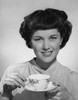 Portrait of a young woman holding a tea cup Poster Print - Item # VARSAL25512681