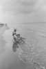 Senior couple sitting on the beach Poster Print - Item # VARSAL25534870