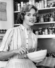 Young woman holding a bowl and smiling Poster Print - Item # VARSAL25535472