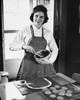 Young woman mixing chocolate in a bowl and smiling Poster Print - Item # VARSAL2555486