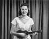 Portrait of young woman playing ukulele Poster Print - Item # VARSAL25549911