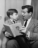 Father reading a story to his son Poster Print - Item # VARSAL25516042A