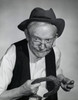 Close-up of a senior man holding a horseshoe Poster Print - Item # VARSAL25524626