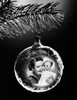 Close-up of an image of a girl hugging a doll superimposed on a Christmas ornament Poster Print - Item # VARSAL25518570