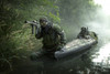 Navy SEALs navigate the waters in a folding kayak during jungle warfare operations Poster Print - Item # VARPSTTWE300003M