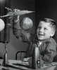 Close-up of a boy playing with a model of a rocket Poster Print - Item # VARSAL2555268