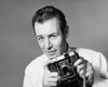 Portrait of a photographer holding a camera Poster Print - Item # VARSAL2557781