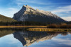 Mountain lake reflecting mountain at sunset with blue sky and clouds, Banff National Park; Alberta, Canada PosterPrint - Item # VARDPI12290284