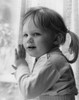 Small girl with pigtails by window Poster Print - Item # VARSAL25514380
