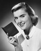 Close-up of a young woman holding a bank book and smiling Poster Print - Item # VARSAL25534352
