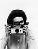 Female photographer taking a photograph Poster Print - Item # VARSAL2557796