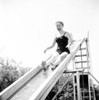 Girl on water slide in park Poster Print - Item # VARSAL255422178