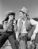 Cowgirl and cowboy sitting on fence Poster Print - Item # VARSAL255421167
