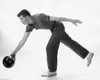 Young adult man rolling a bowling ball Poster Print - Item # VARSAL2555698