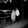 Teenage couple in formal clothes next to car Poster Print - Item # VARSAL255422361