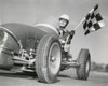 Mid adult man driving a car and holding a checkered flag Poster Print - Item # VARSAL2555567