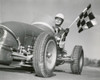Mid adult man driving a car and holding a checkered flag Poster Print - Item # VARSAL2555567
