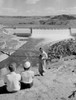 Boy taking photo of parents  dam in the background Poster Print - Item # VARSAL255419367