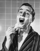 Portrait of a mid adult man shaving Poster Print - Item # VARSAL25549179