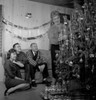 Family preparing Christmas tree in living room Poster Print - Item # VARSAL255417603