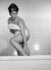Young woman standing in bathtub Poster Print - Item # VARSAL255417337