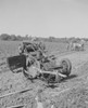 Overturned car in a field  crowd gathered near injured. Poster Print - Item # VARSAL255422760