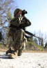 A soldier looking through binoculars for improvised explosive devices Poster Print