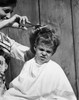 Mother cutting her son's hair Poster Print - Item # VARSAL25519792