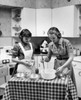 Two young women cooking Poster Print - Item # VARSAL25535488